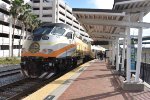 The Sunrail train collects and discharges passengers at Church Street Station